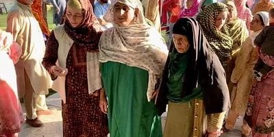 The mother (in green) of Mohammad Asif who was killed in “accidental firing” near a security checkpoint in south Kashmir on Wednesday. Photo: Jehangir Ali
